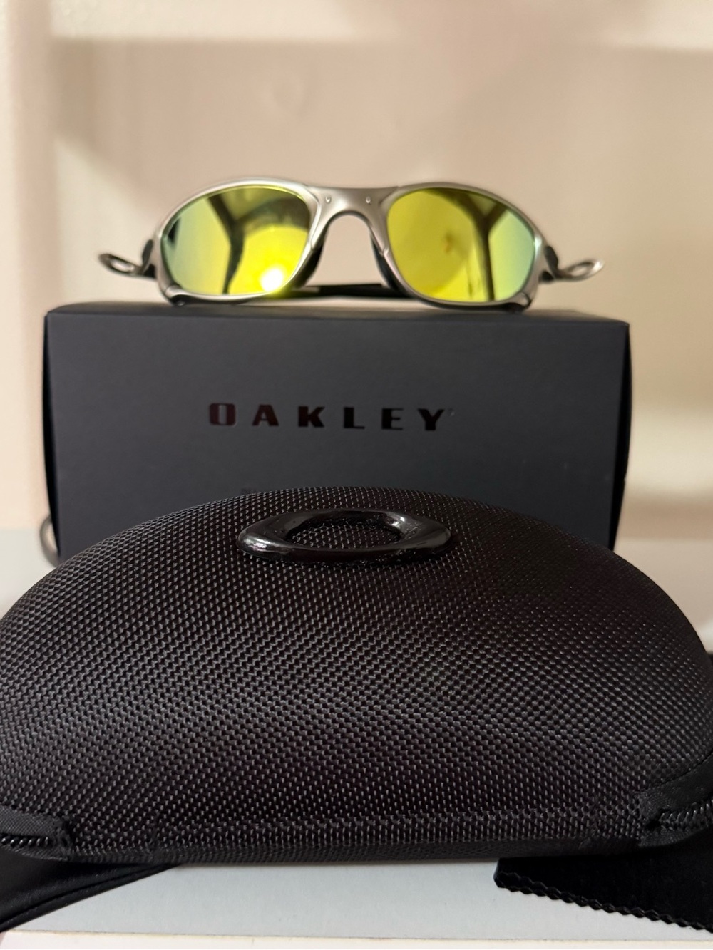 Oakley Silver Frame Sunglasses with Yellow Mirrored Lenses